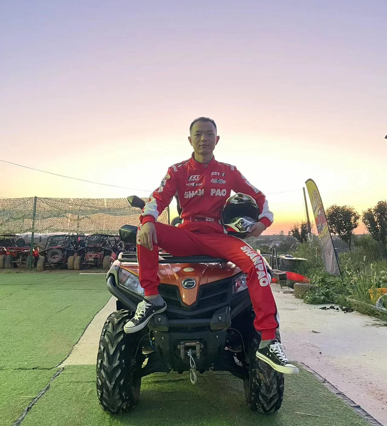 Sam on a quad bike at sunset
